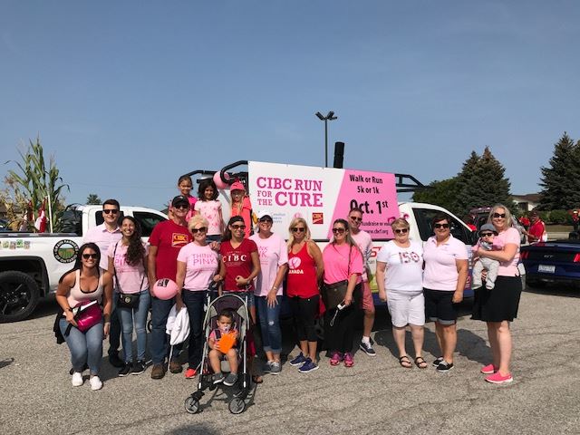 Jackie Raymond and Donna Bilodeau (2nd and 3rd from right) with their pink crew